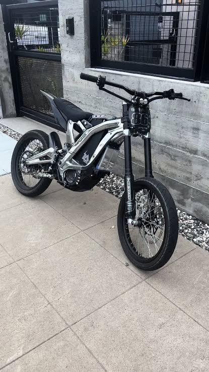 Custom Sur-Ron electric dirt bike with polished frame